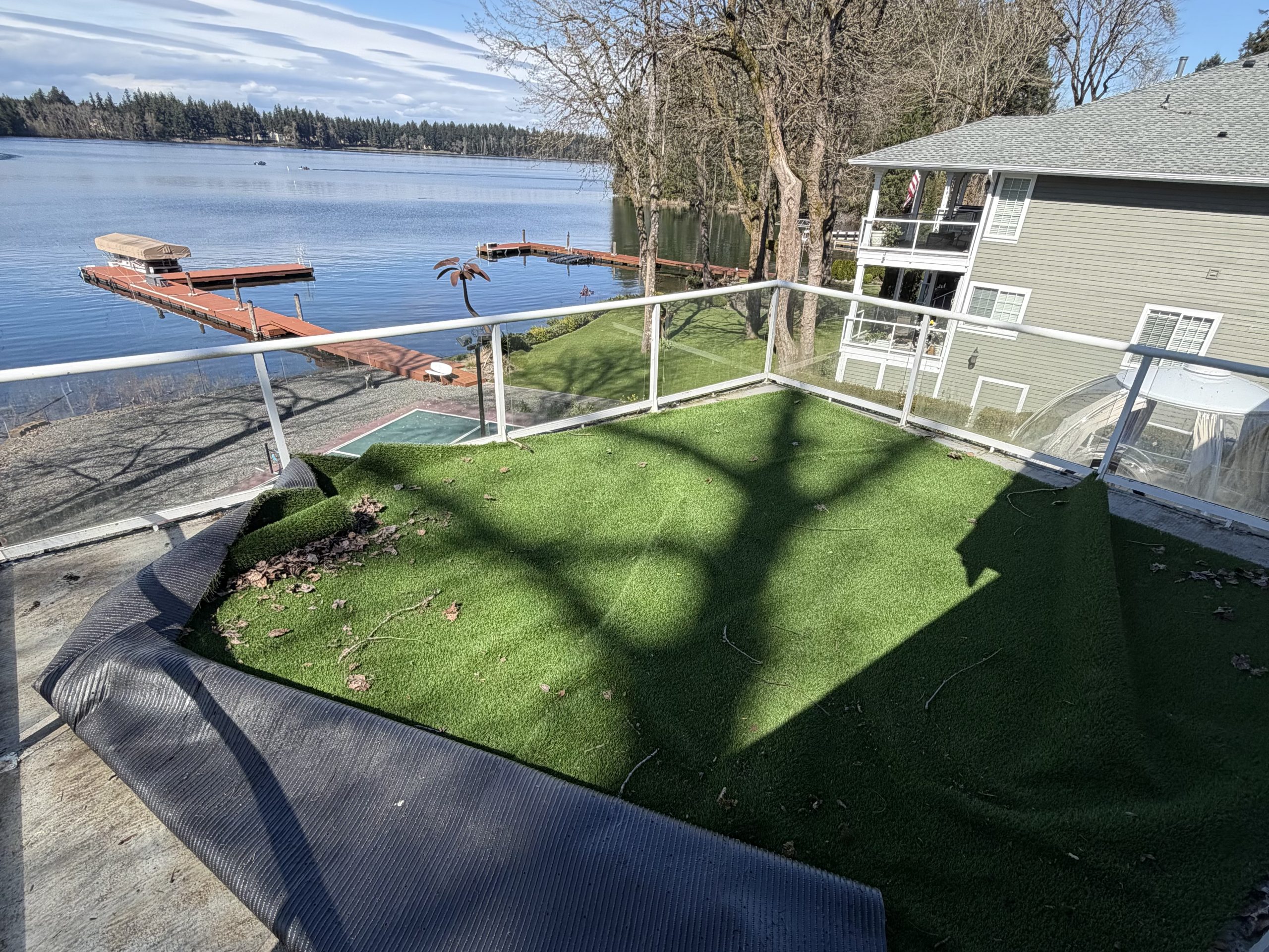 property cleanout Tacoma deck cleanup with artificial turf removal